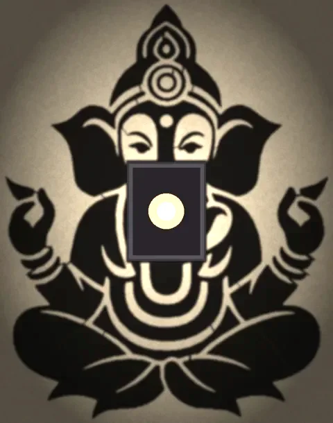 Ganesha silhouette shadow lamp on a plaster wall